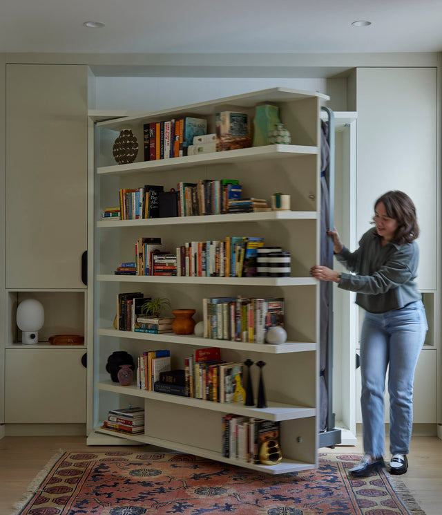 This Basement Built-In Transforms From Bookshelf to Bed
