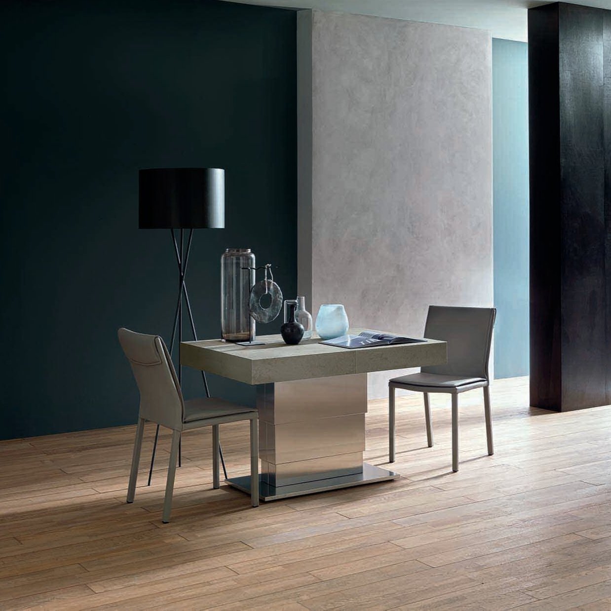 Side view of the Ceres Maxi table elevated, highlighting its sturdy metallic base and sophisticated tabletop finish.