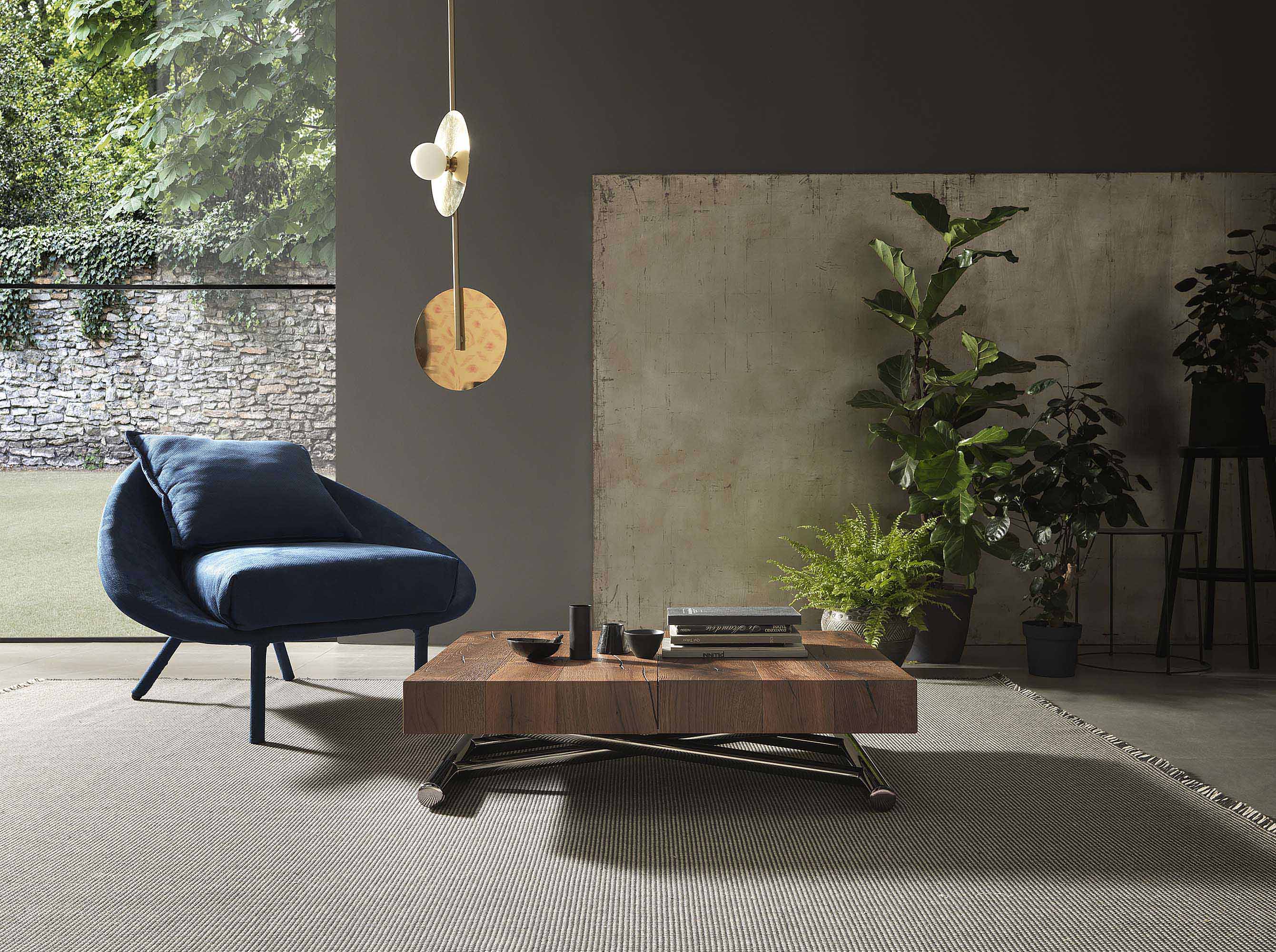 Cristallo Mini table used as a centerpiece in a living room, styled with books and decorative items.