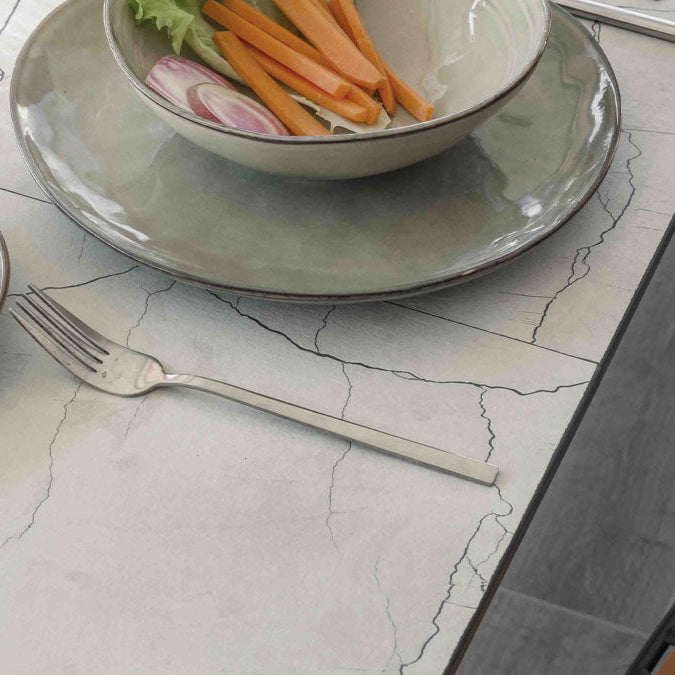 A close-up of the Goliath Outdoor's surface showcasing the marble-like texture and details of the tabletop.
