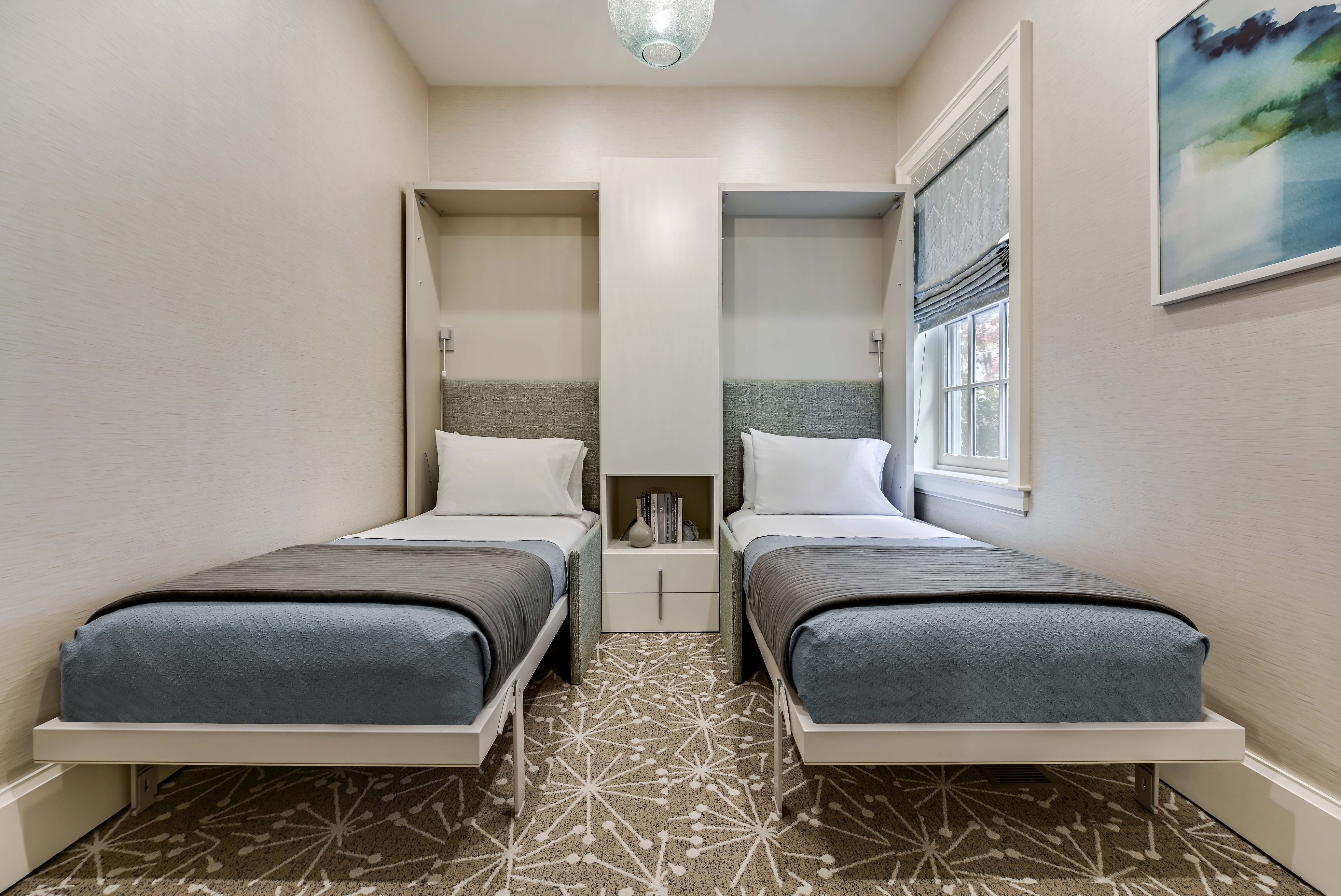 Altea Sofa Murphy bed with sofa shown fully open as two twin beds, highlighting space saving furniture ideal for compact guest rooms.