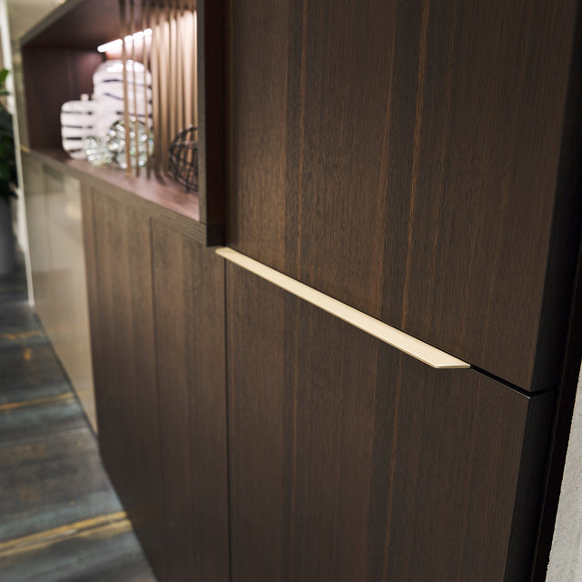 Close-up of custom entryway cabinet in wood finish with exclusive handle detail – space saving furniture by Resource Furniture.