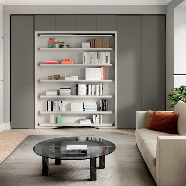 Closed LGM wall bed system displayed as a floor-to-ceiling bookshelf, seamlessly blending into a modern living room—perfect for luxury multifunctional design in compact spaces.