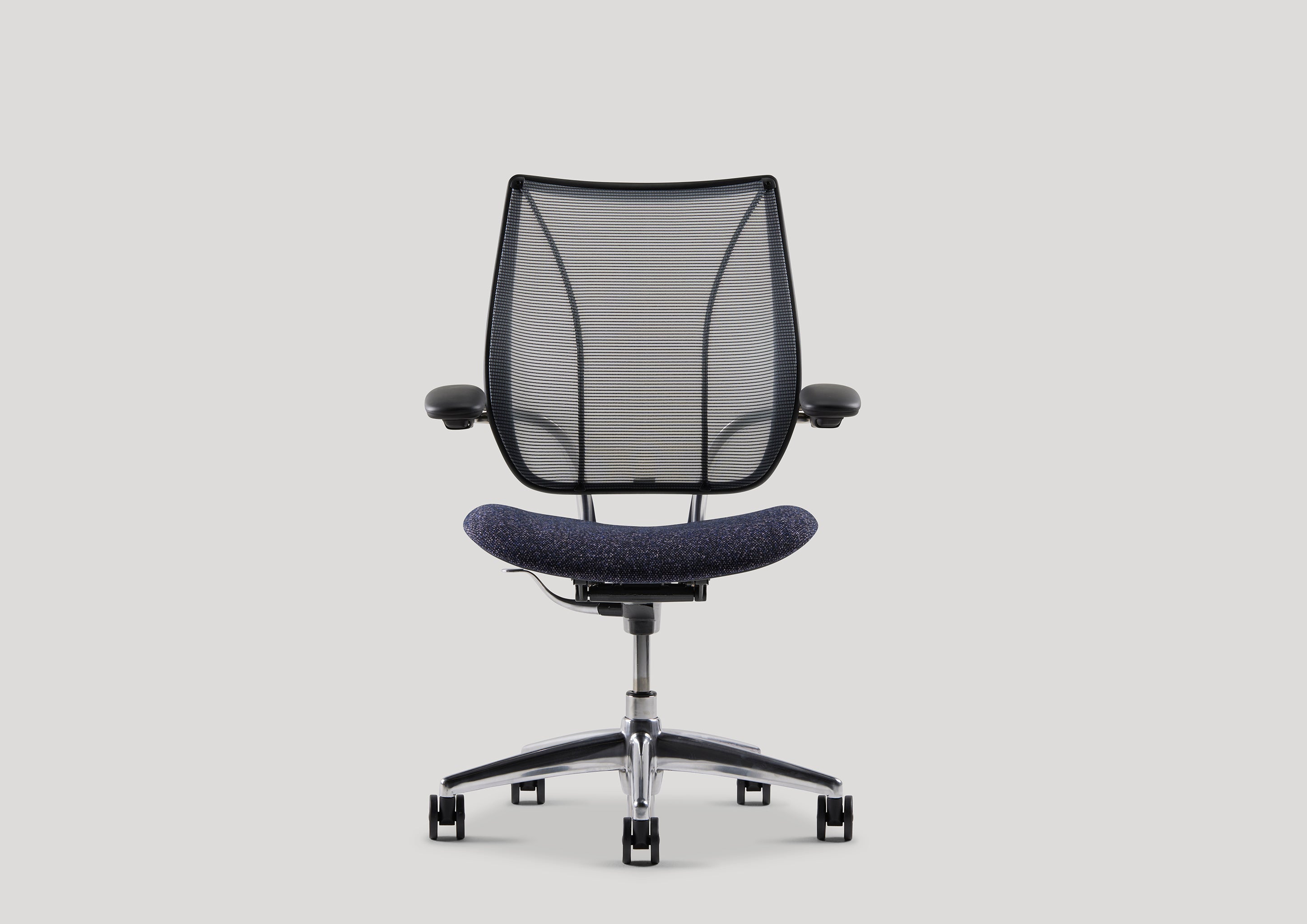 Front view of Liberty Task Chair featuring a navy Kvadrat seat and transparent mesh backrest