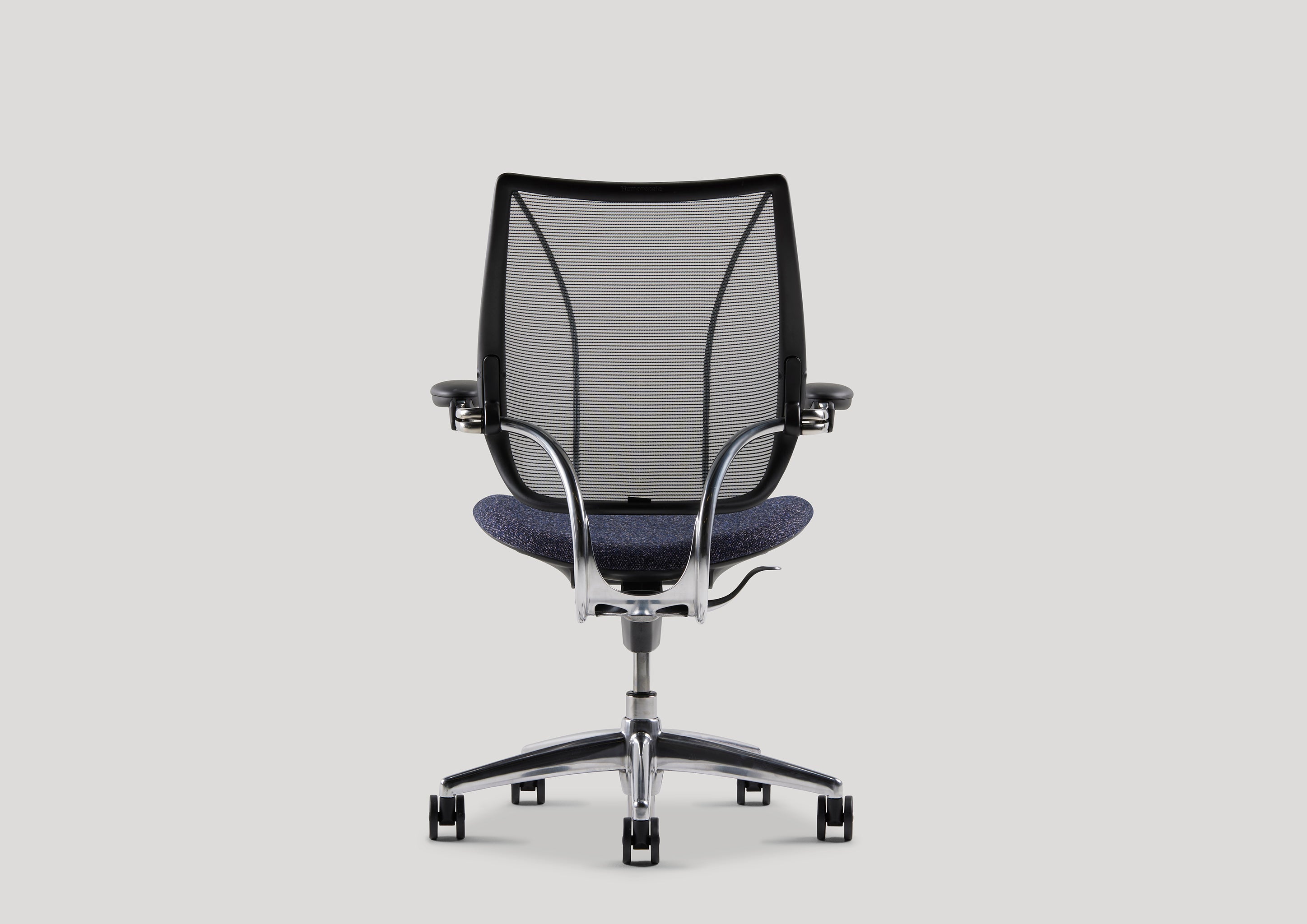 Rear view of the Liberty Task Chair with breathable mesh back and contoured seat in studio setting.