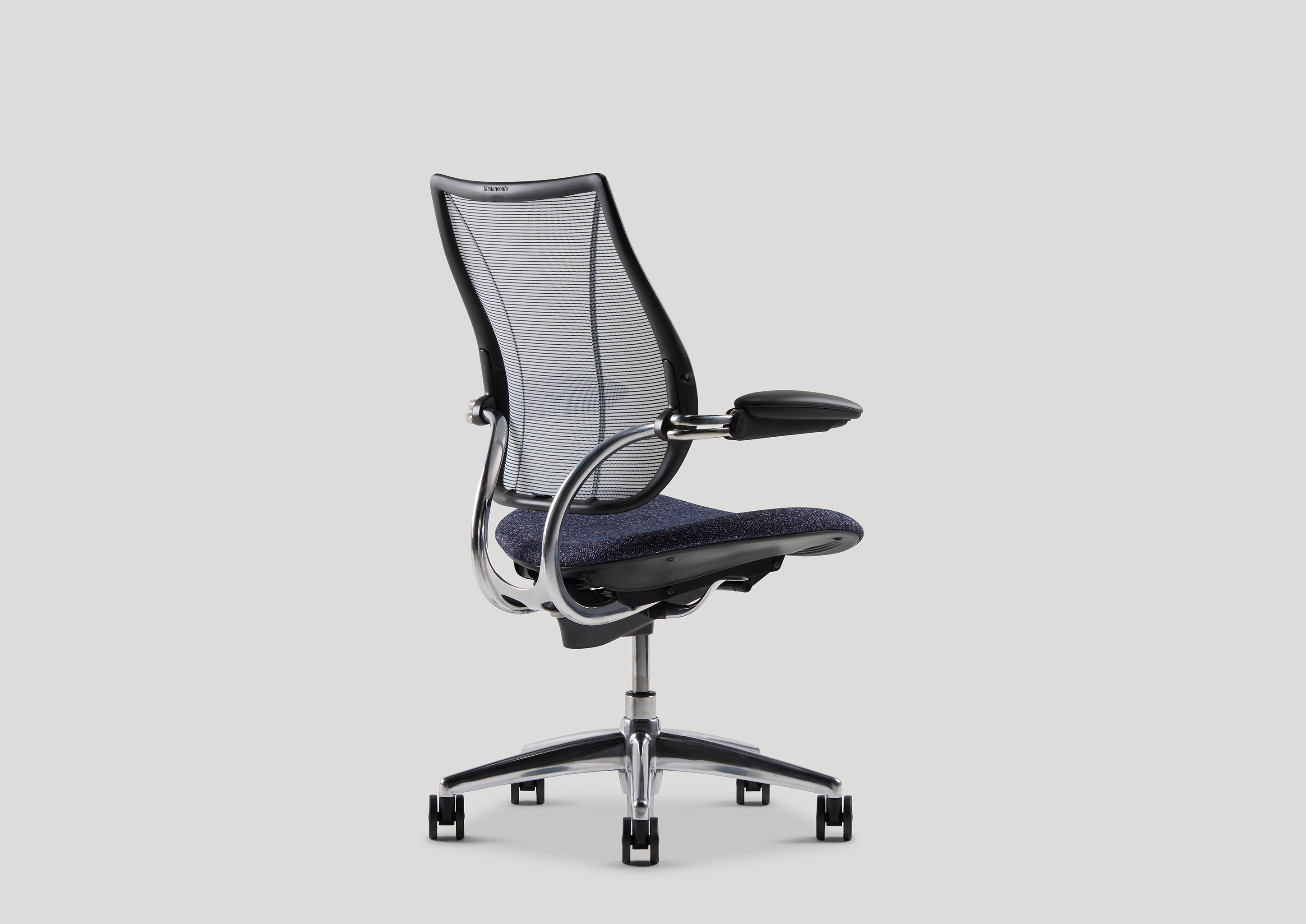 Angled rear perspective of Liberty Task Chair with contoured mesh back and chrome detailing