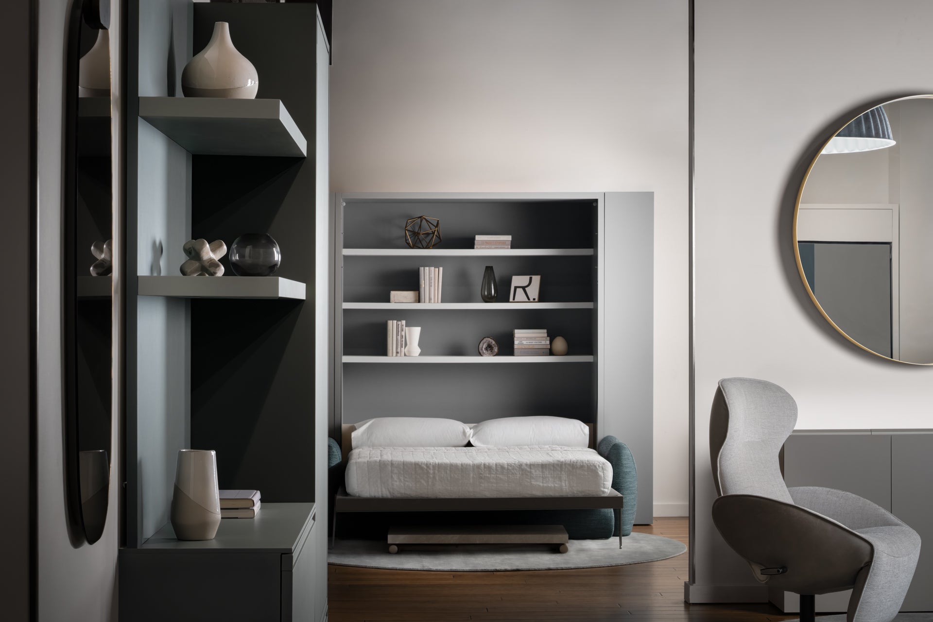 Minerva motorized vertical sofa wall bed in the open position — teal sofa converted to bed with white bedding and built-in shelves; space-saving furniture, Resource Furniture Seattle showroom.