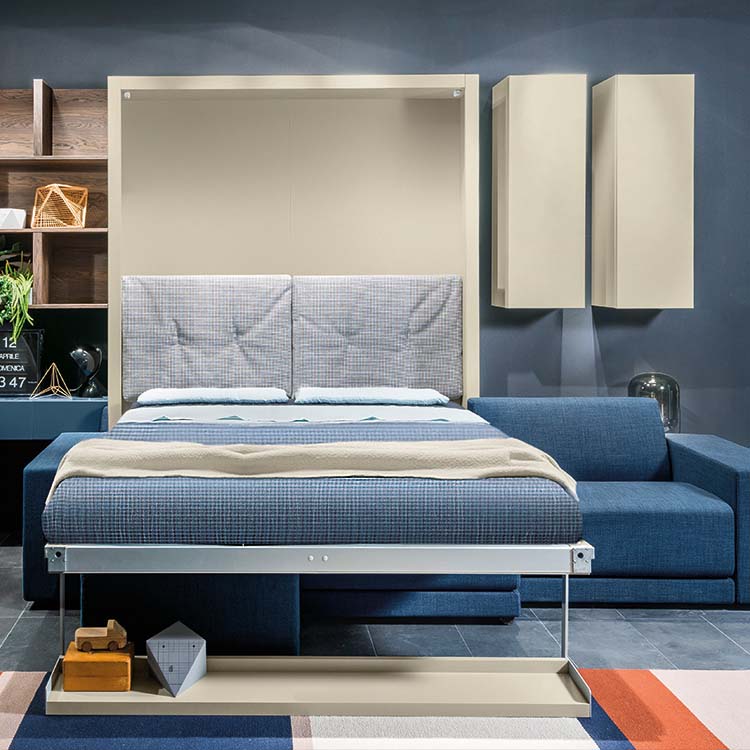 Oslo sectional queen Murphy bed open with upholstered headboard and contemporary sofa in multifunctional furniture room.