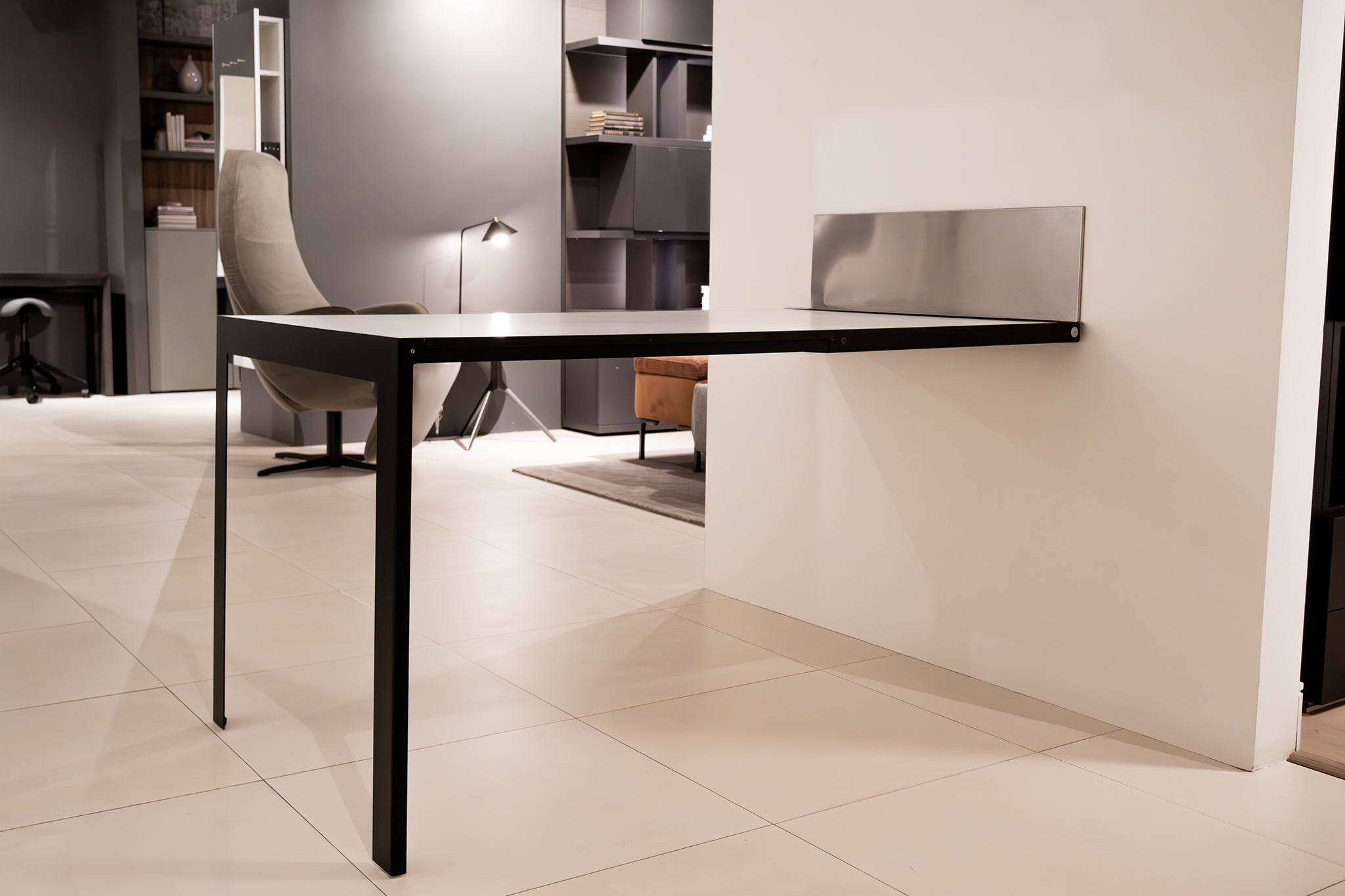Specchio table fully extended from the wall, creating a functional dining surface.