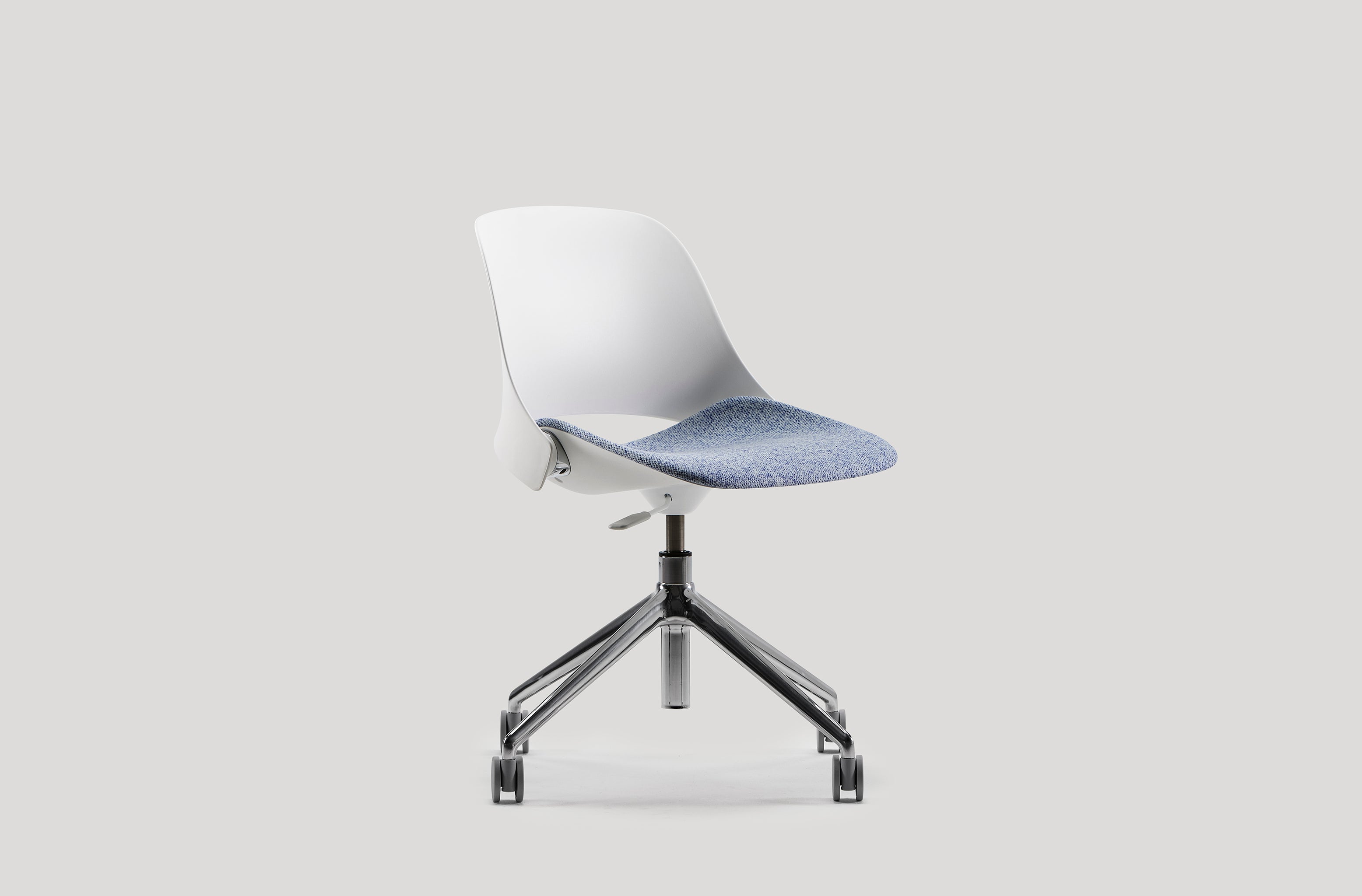 Angled front studio view of the Trea Chair, showing clean lines and ergonomic structure on a white background.