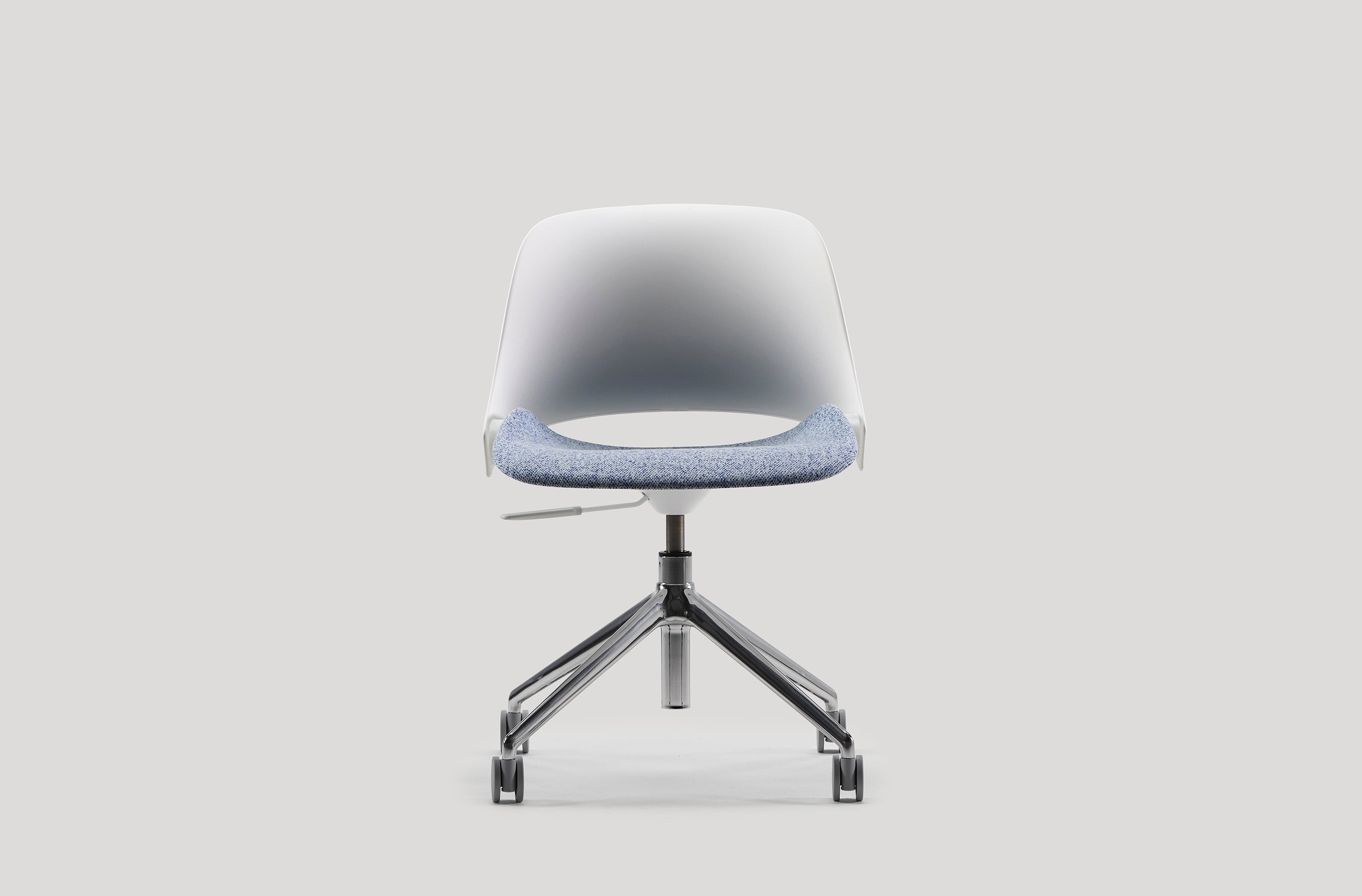 Front view of the Trea Chair with subtle curvature, showcasing its symmetrical and ergonomic form.