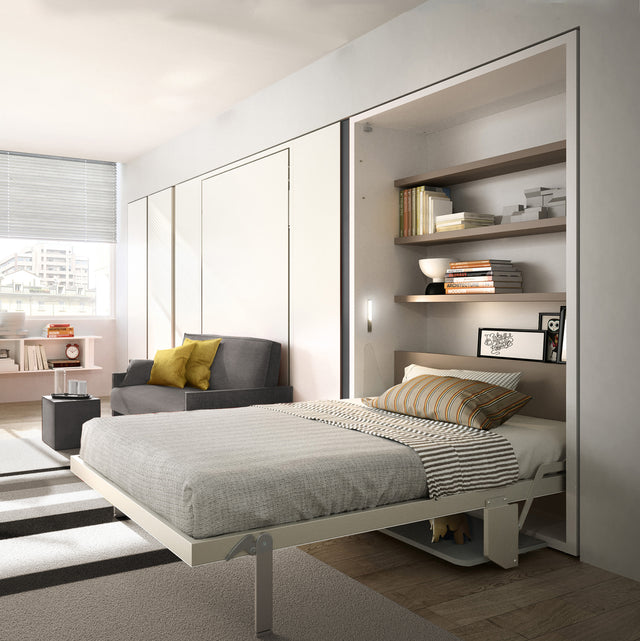 Altea Desk Murphy bed fully open with built-in bookshelf and modern gray sofa in compact bedroom.