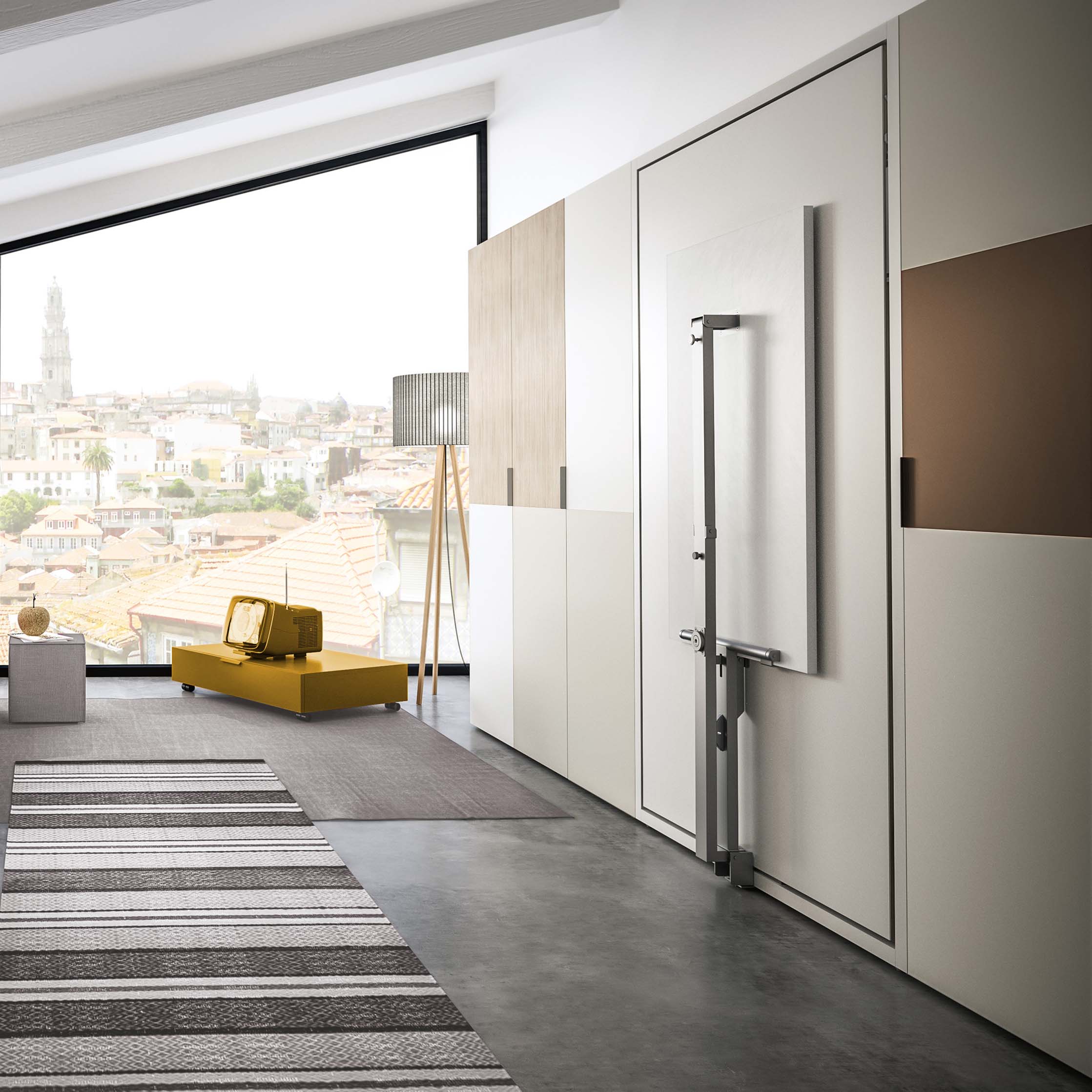 Altea Work murphy bed in vertical closed position with the desk neatly folded away, revealing the bed’s compact hidden form against built-in cabinetry.