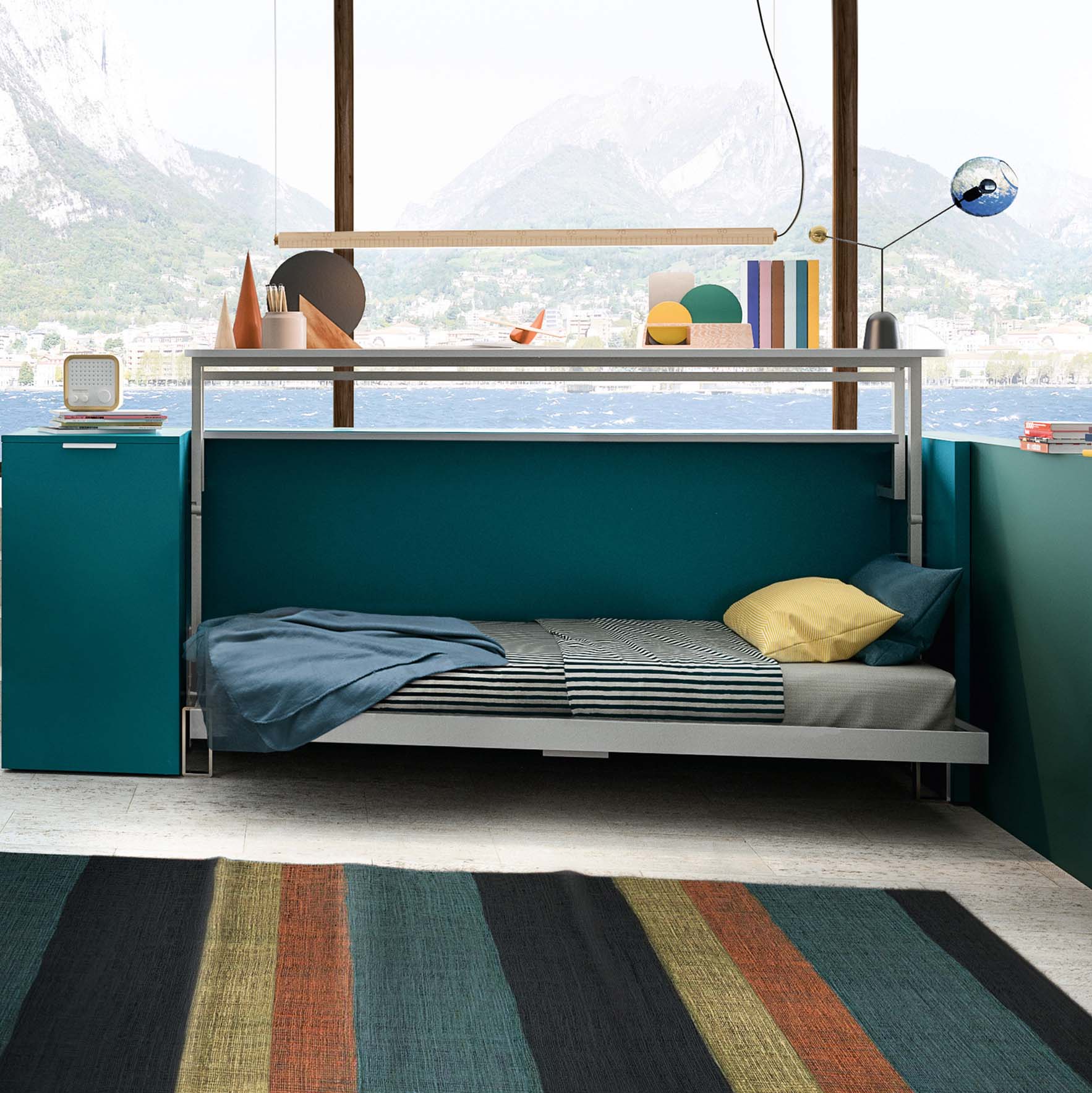 Cabrio Murphy Bed shown open with striped bedding and pillows, in a compact home office with teal cabinetry – multifunctional space saving furniture for small rooms.