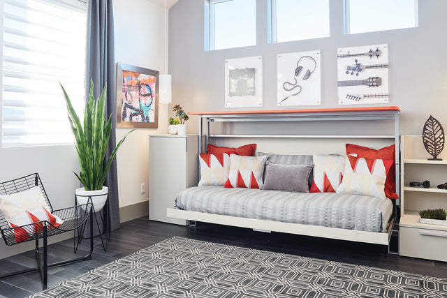 Cabrio Murphy Bed shown in sofa configuration with decorative pillows, highlighting multifunctional space saving furniture for small home offices or guest rooms.