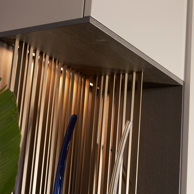 Custom cabinetry units wood panel detail with integrated lighting — modern craftsmanship by Resource Furniture.