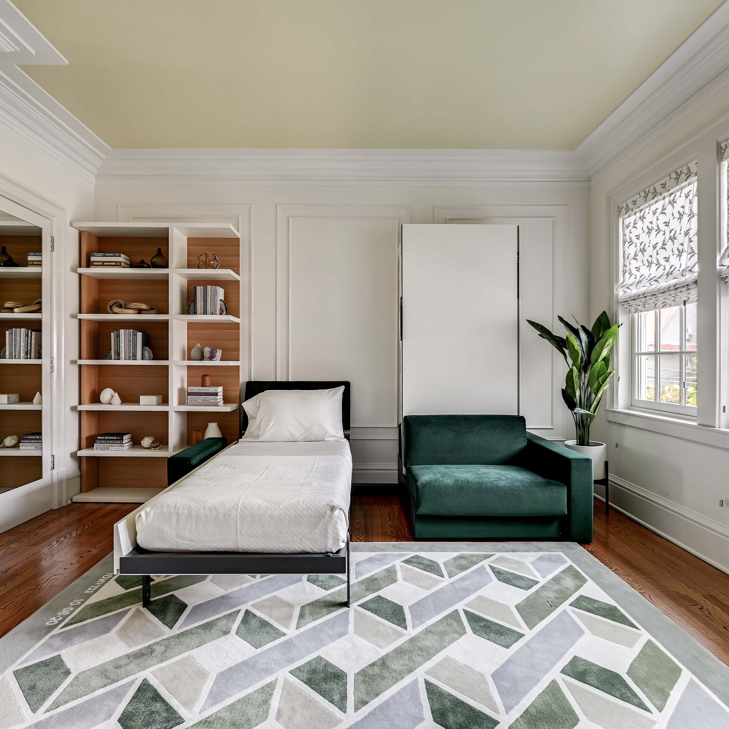Ella & Louis Freestanding Queen Wall Beds with Sofas, featuring one bed open in twin position while the other remains closed, illustrating flexible space-saving furniture in use.
