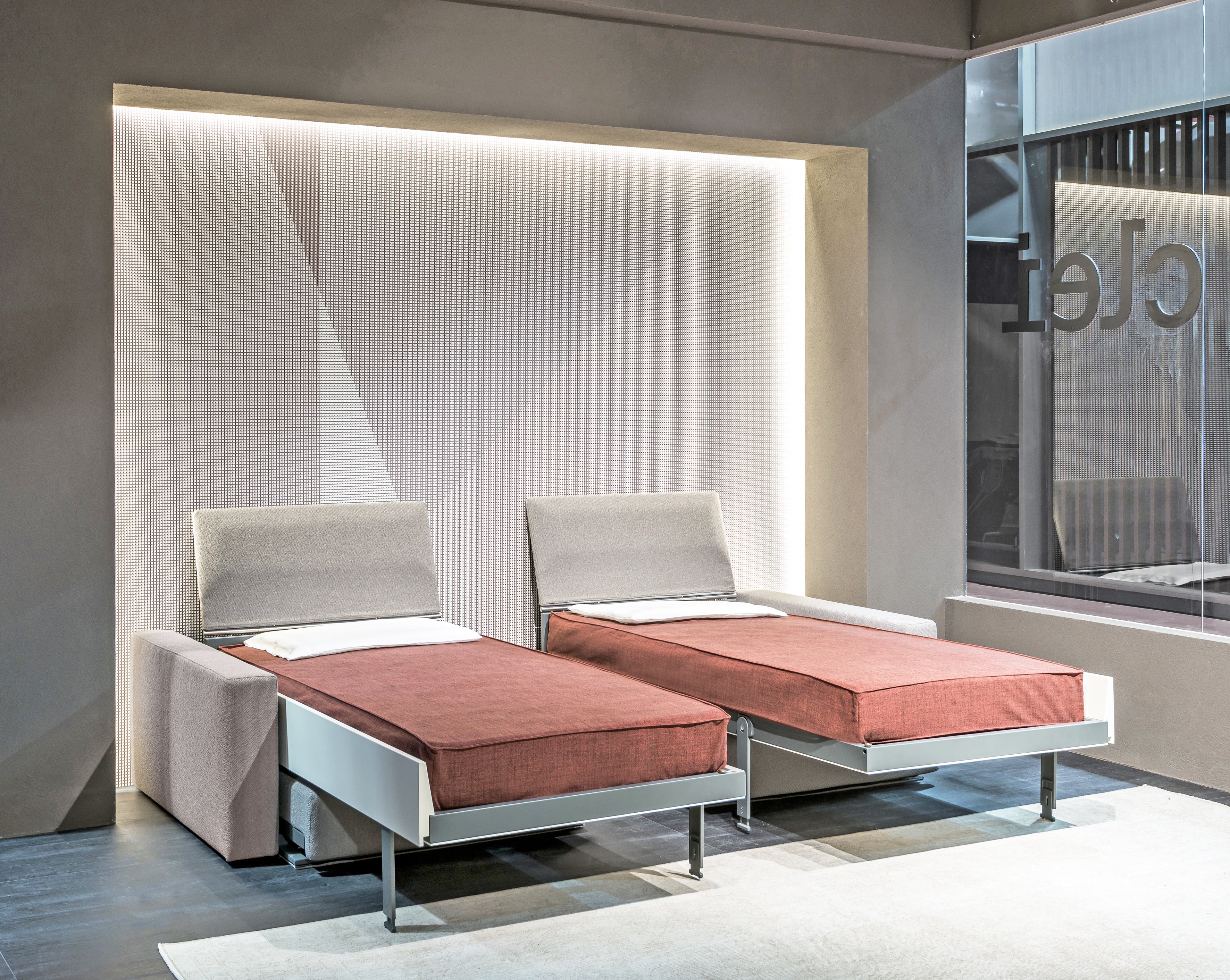 Ella & Louis Murphy bed fully extended as two twin beds, featuring rust-colored bedding.