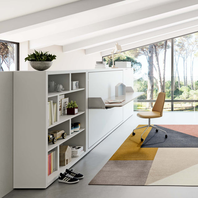 Kali Desk wall bed with desk in closed position, featuring built-in shelving and workspace in a bright modern room.