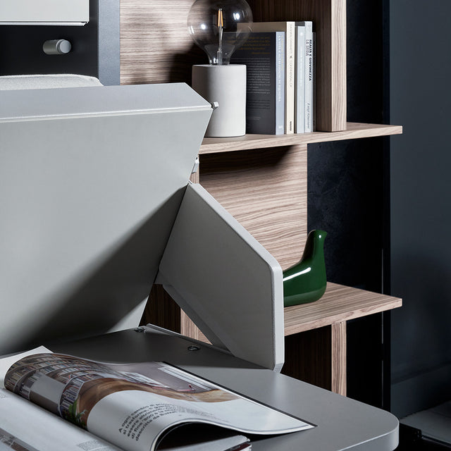 Close-up of the Kali Duo Desk bottom bunk transitioning downward, with focus on the desk surface and surrounding shelf decor in a multifunctional space saving setup.