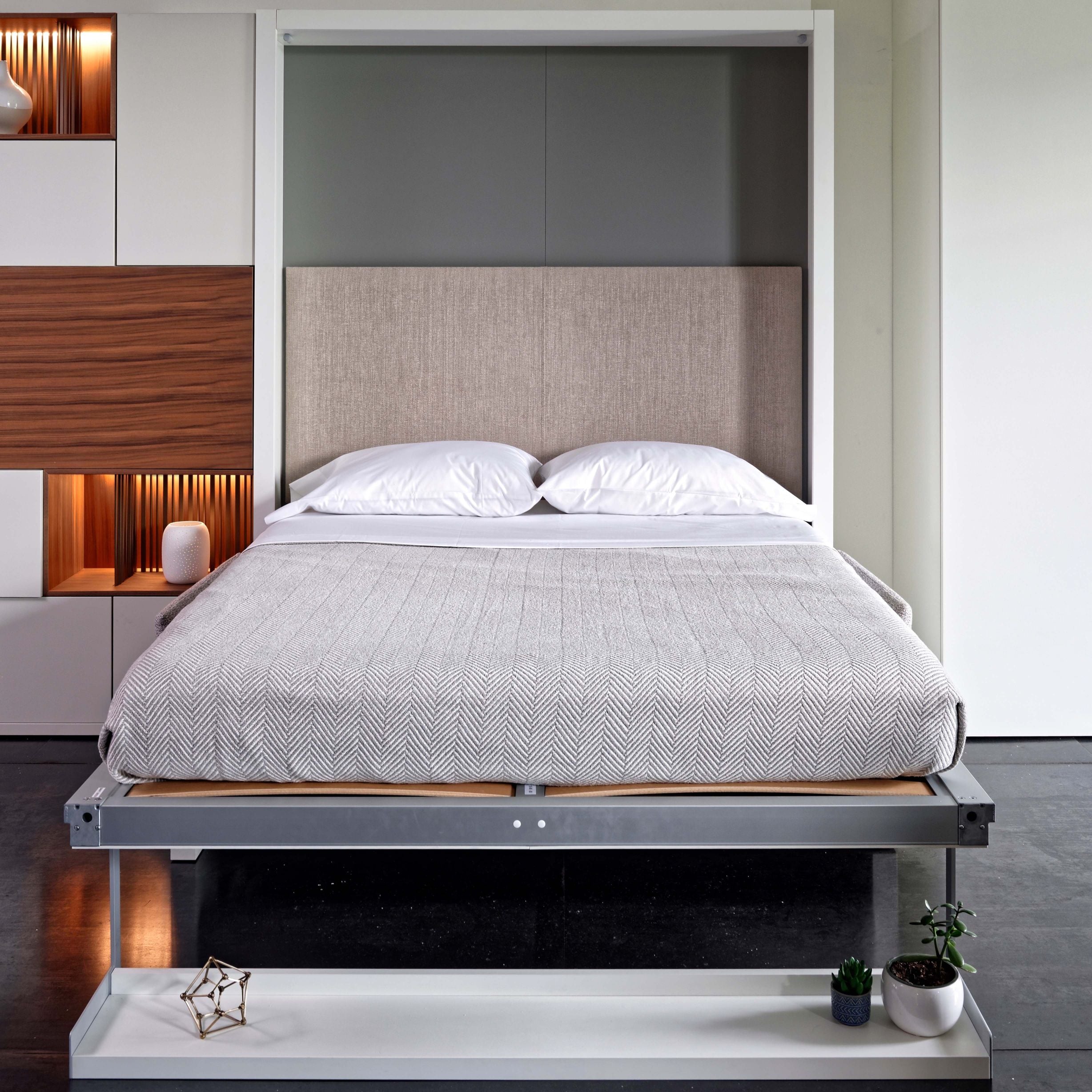 Nuovoliola queen wall bed fully open with integrated headboard and neatly made bedding.