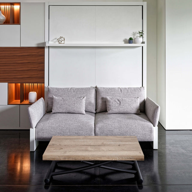 Nuovoliola queen wall bed with sofa in a modern living room, bed closed and cushions in place.