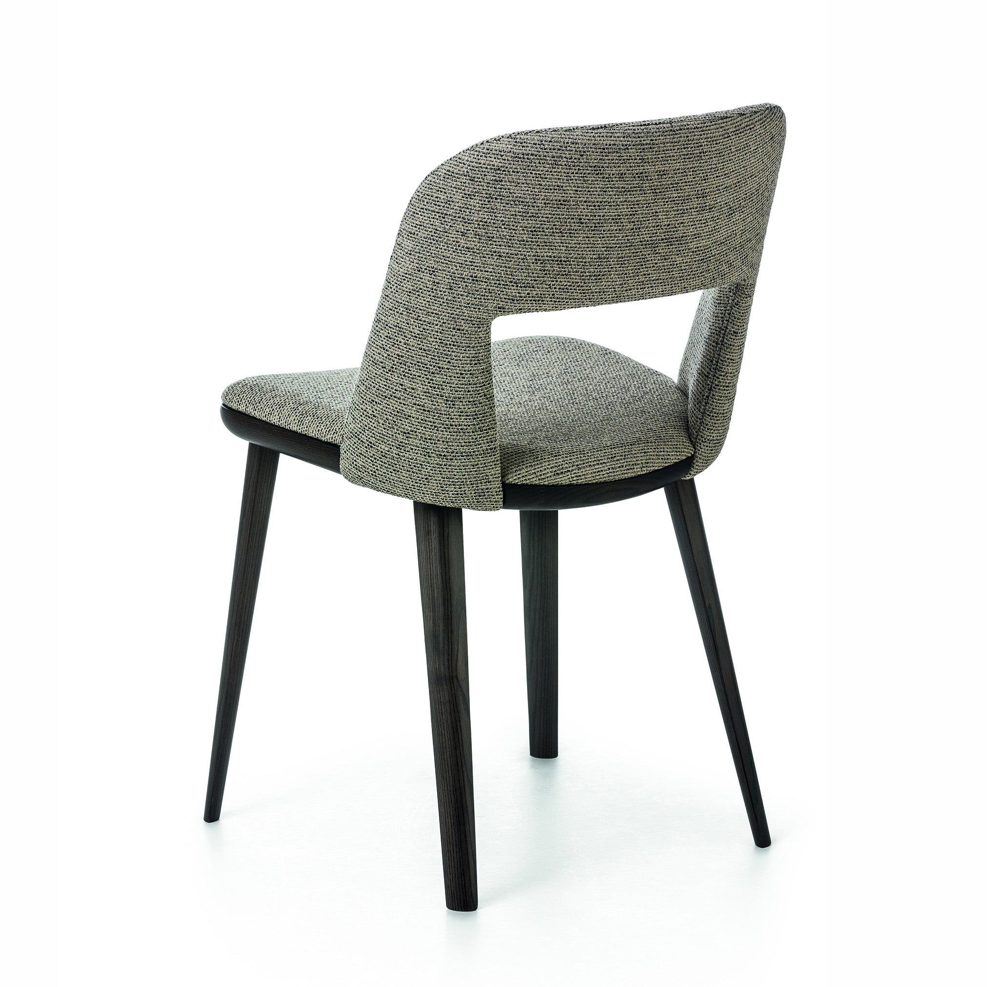 Three-quarter rear view of Path dining chair showing open back design and contoured seat with dark wood base.