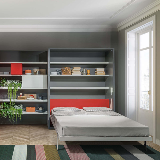Penelope Murphy bed open with integrated shelving and red headboard in a stylish modern room.