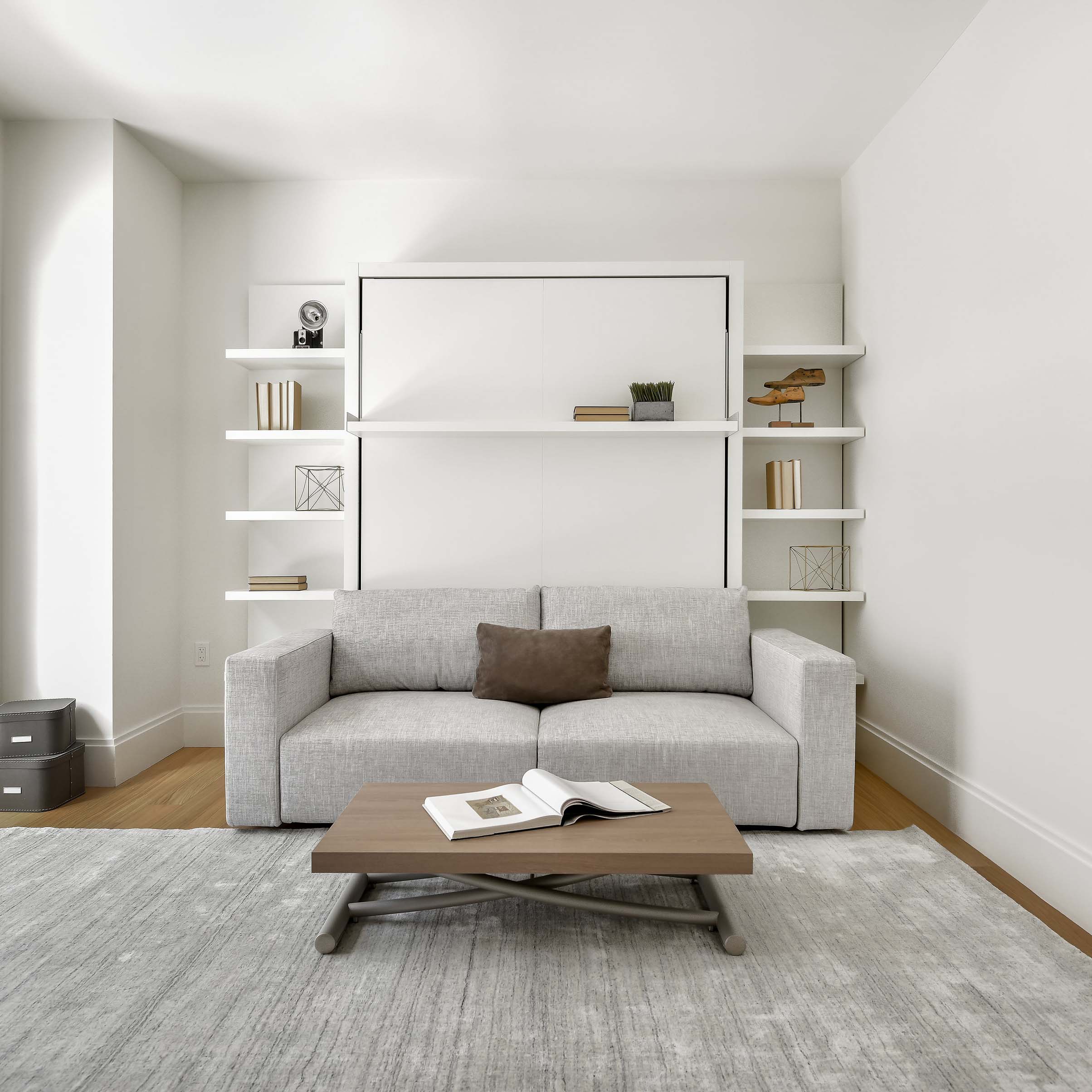 Swing 0 Murphy bed closed with integrated light gray sofa and custom built-in shelving in modern living room.