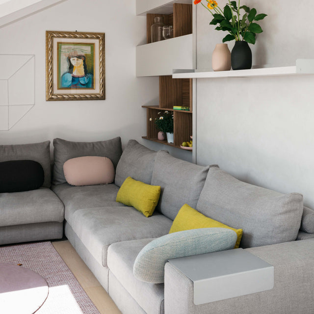 Tango Sectional Murphy bed in sofa configuration with modular gray couch and built-in shelving.