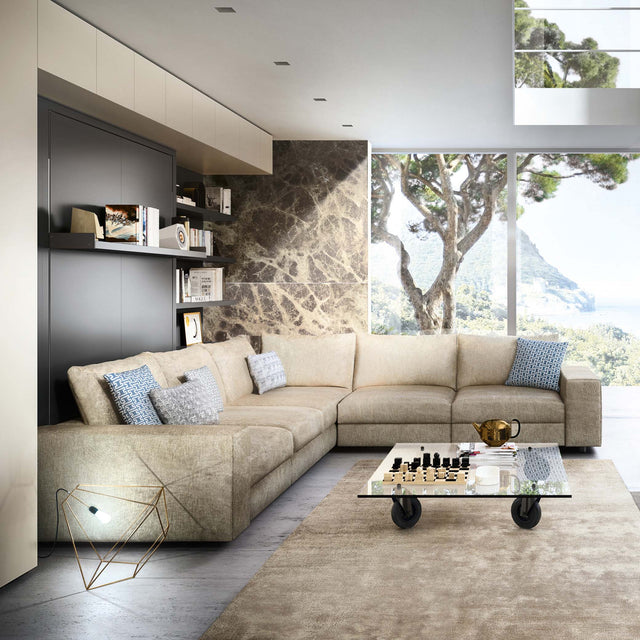 Tango Sectional Murphy bed closed, with beige L-shaped sofa, marble accent wall, and built-in shelving in luxury interior.