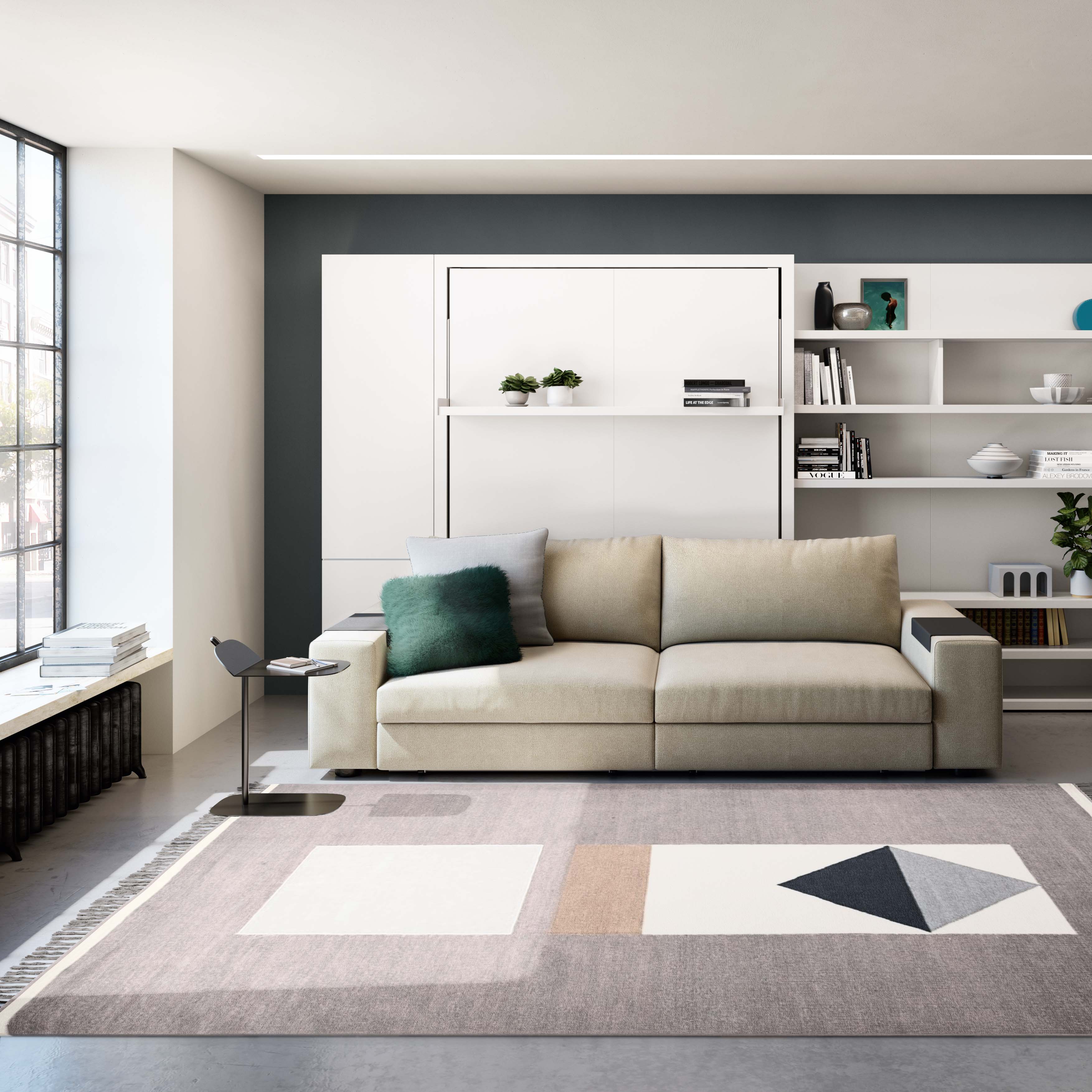 Stylish contemporary living room featuring the Tango Sofa with integrated wall bed, framed by modular shelving and minimalist decor—ideal for small-space luxury interiors.