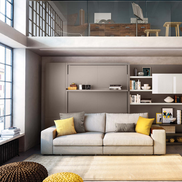 Modern living room with Italian-designed Tango wall bed system featuring a built-in sofa, surrounded by modular shelving—ideal for small space living and multifunctional interiors.
