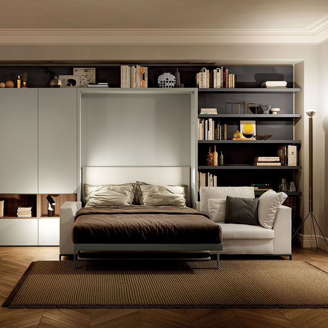 Tonale Sectional wall bed fully extended in a modern living room with integrated shelving—illustrating multifunctional luxury furniture for compact living.