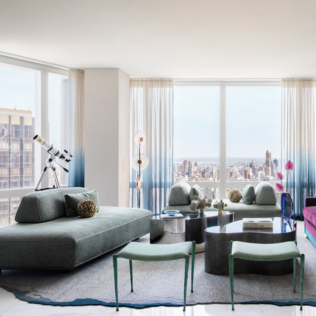 Modern NYC living room featuring the Flex modular sofa with city skyline views, designed by Peti Lau.