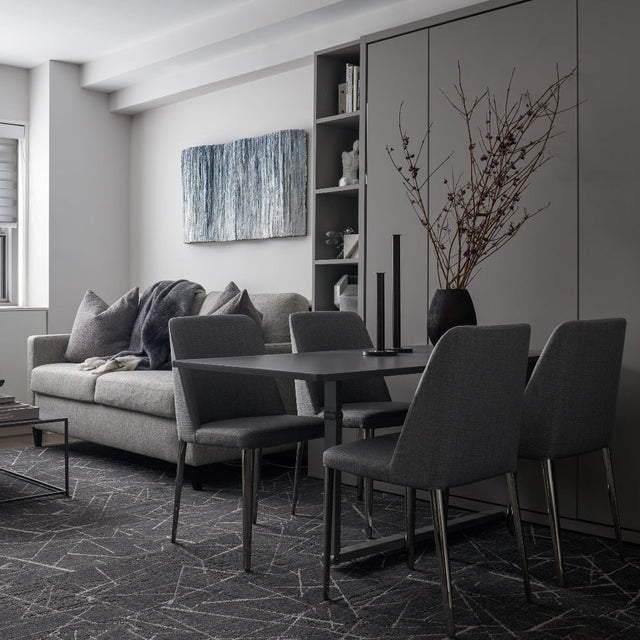 Penelope Dining Wall Bed in a JLW Interiors studio, shown in closed position beside a sofa. Photo by Nathan Schroder.