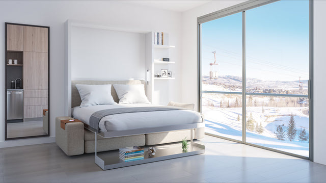 The Tango Sofa wall bed by Resource Furniture shown open as a luxurious queen bed in a modern YotelPad Park City unit, demonstrating innovative, multifunctional design.