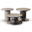 Set of three Bobbin side and coffee tables in varying heights and finishes, featuring sculptural bases and smooth tops in neutral tones.