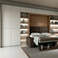 Double-door cabinets flanking a sofa wall bed, featuring customizable finishes and integrated shelving with LED lighting.