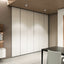 Sleek, floor-to-ceiling single-door cabinets with a minimalist design, enhancing storage efficiency in a compact space.