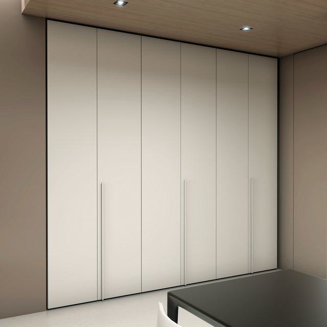 Floor-to-ceiling double-door cabinets with slim handles, providing seamless and stylish storage.