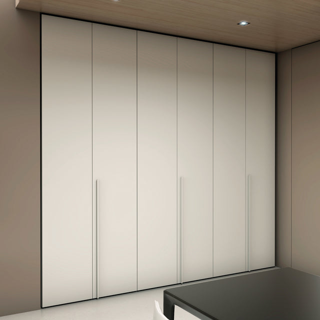 Single- and double-door wardrobes in a clean, modern aesthetic, with integrated handles and adaptable interior storage.