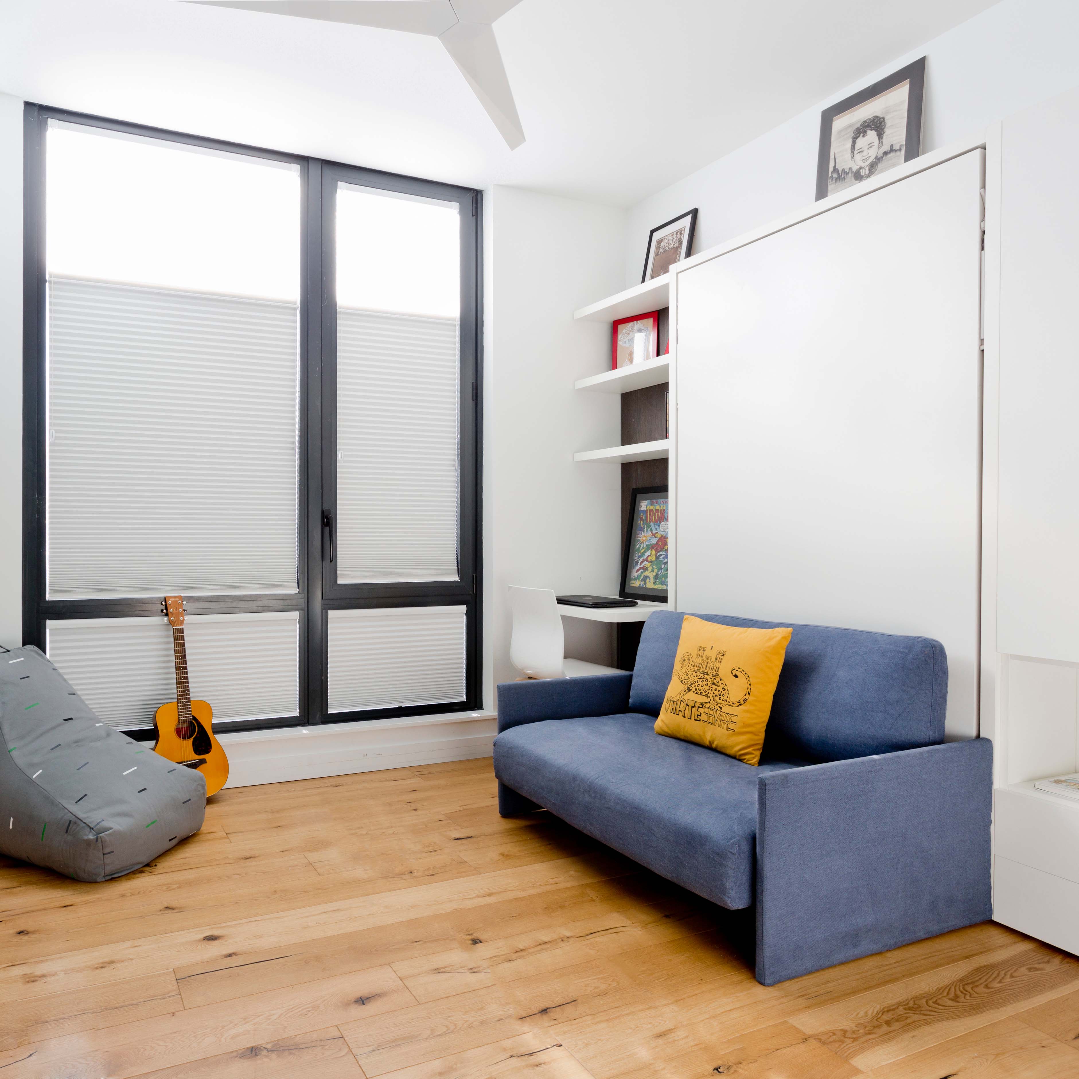 Altea Sofa Murphy Bed in compact NYC bedroom with blue couch and closed wall bed – space saving furniture for small apartments