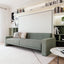 Atena Horizontal Sofa Wall Bed closed as a modern sofa in a styled living room with integrated shelving.