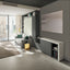 Giro transforming console table closed against the wall beside a modern sofa and modular wall bed in a compact living room by Resource Furniture