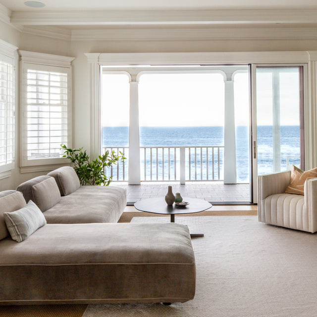Modern Malibu living room with oceanfront views, featuring the Flex modular sofa by Resource Furniture and custom interior design by Becky Spector.