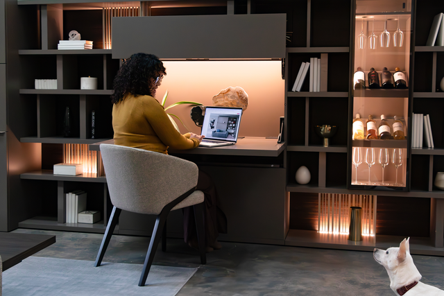 Maxi Desk workspace with shelving and wine display at Resource Furniture Los Angeles showroom.