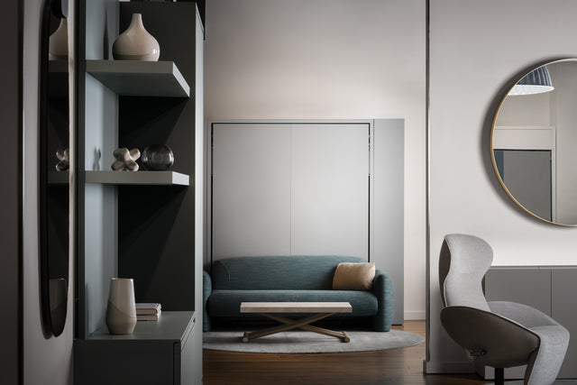 Teal Minerva motorized vertical sofa wall bed folded into the closed position; space-saving furniture, as shown in the Resource Furniture Seattle showroom.