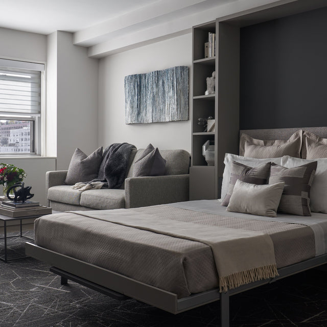 Penelope Dining Wall Bed in a JLW Interiors studio, shown open beside a sofa. Photo by Nathan Schroder.