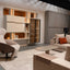 Maxi Bar closed within a custom wall system with open shelving, glass cabinet, and modern lounge seating.